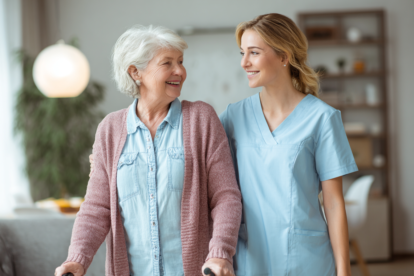 Live-In Caregiver walking with elderly client